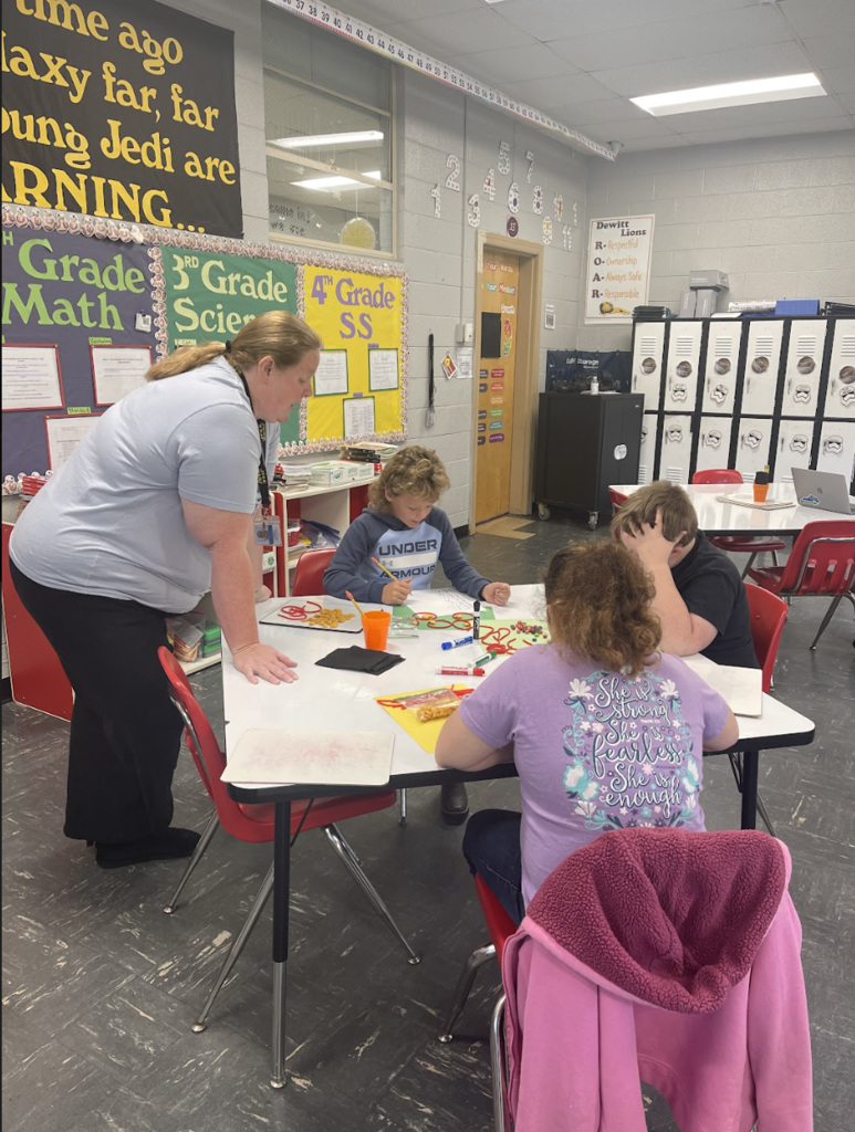 Mrs. Olmstead helping students