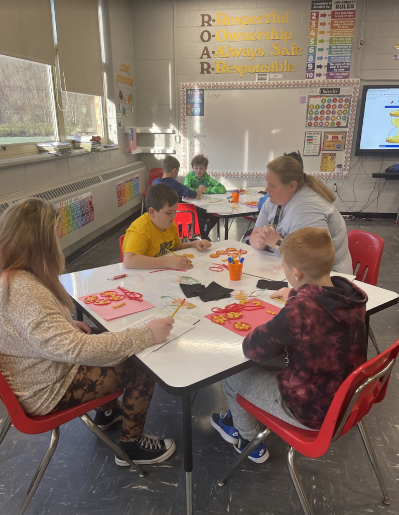Teacher works with a group of students